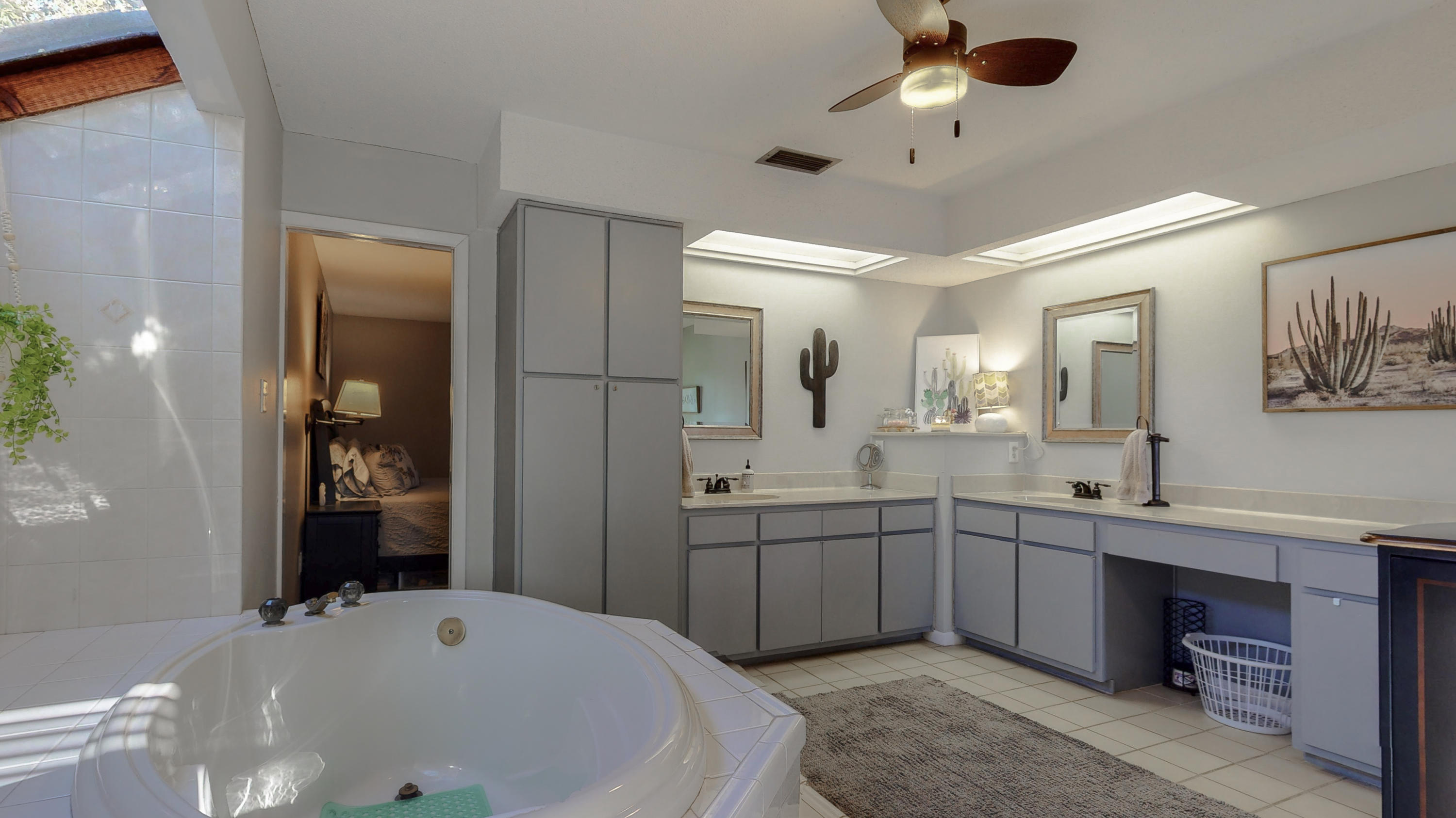 37 Country Club Road Shalimar, FL 32579 - Photo 22 of 64 a bathroom with a tub sink and mirror