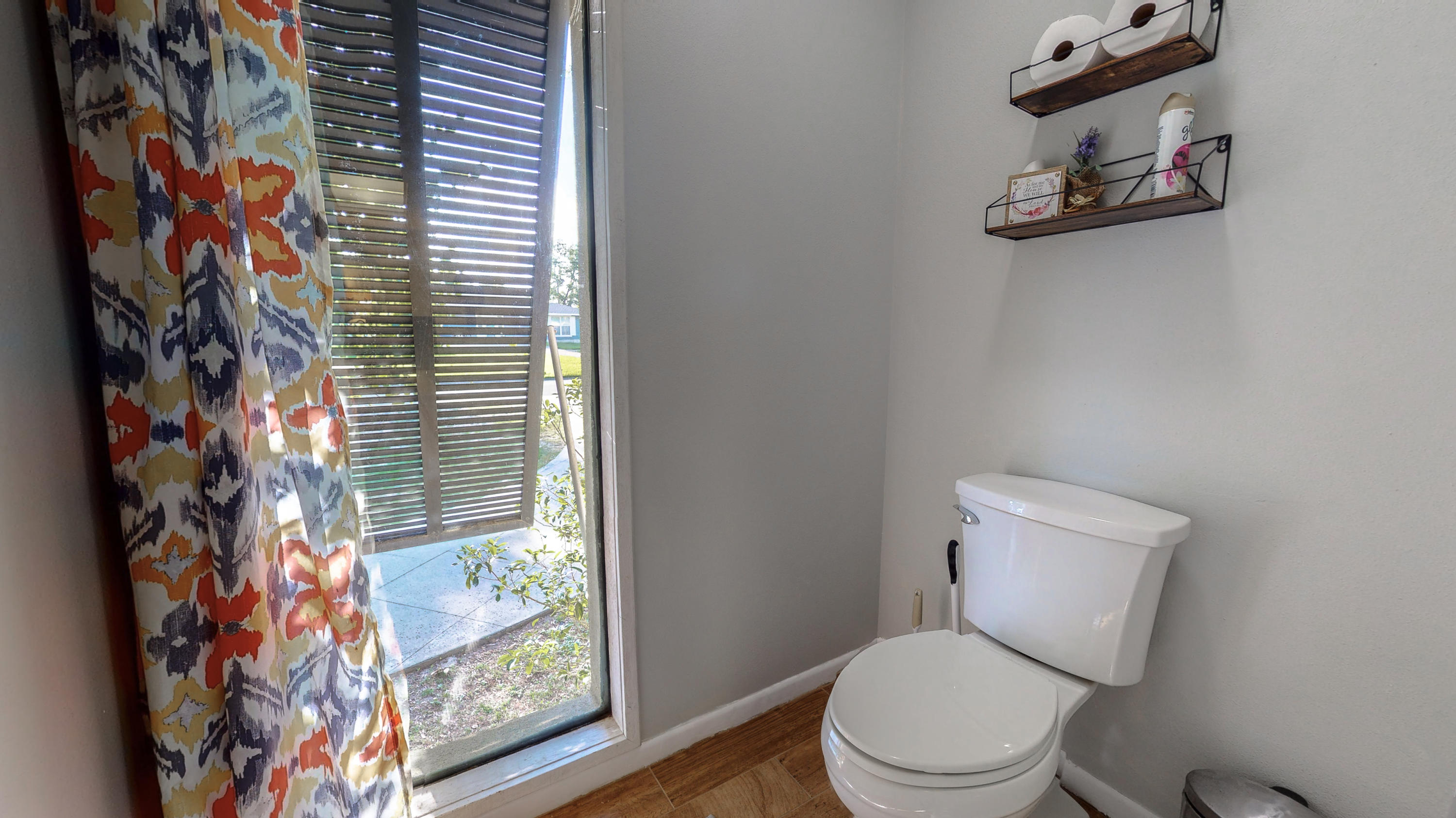 37 Country Club Road Shalimar, FL 32579 - Photo 24 of 64 a white toilet sitting next to a window