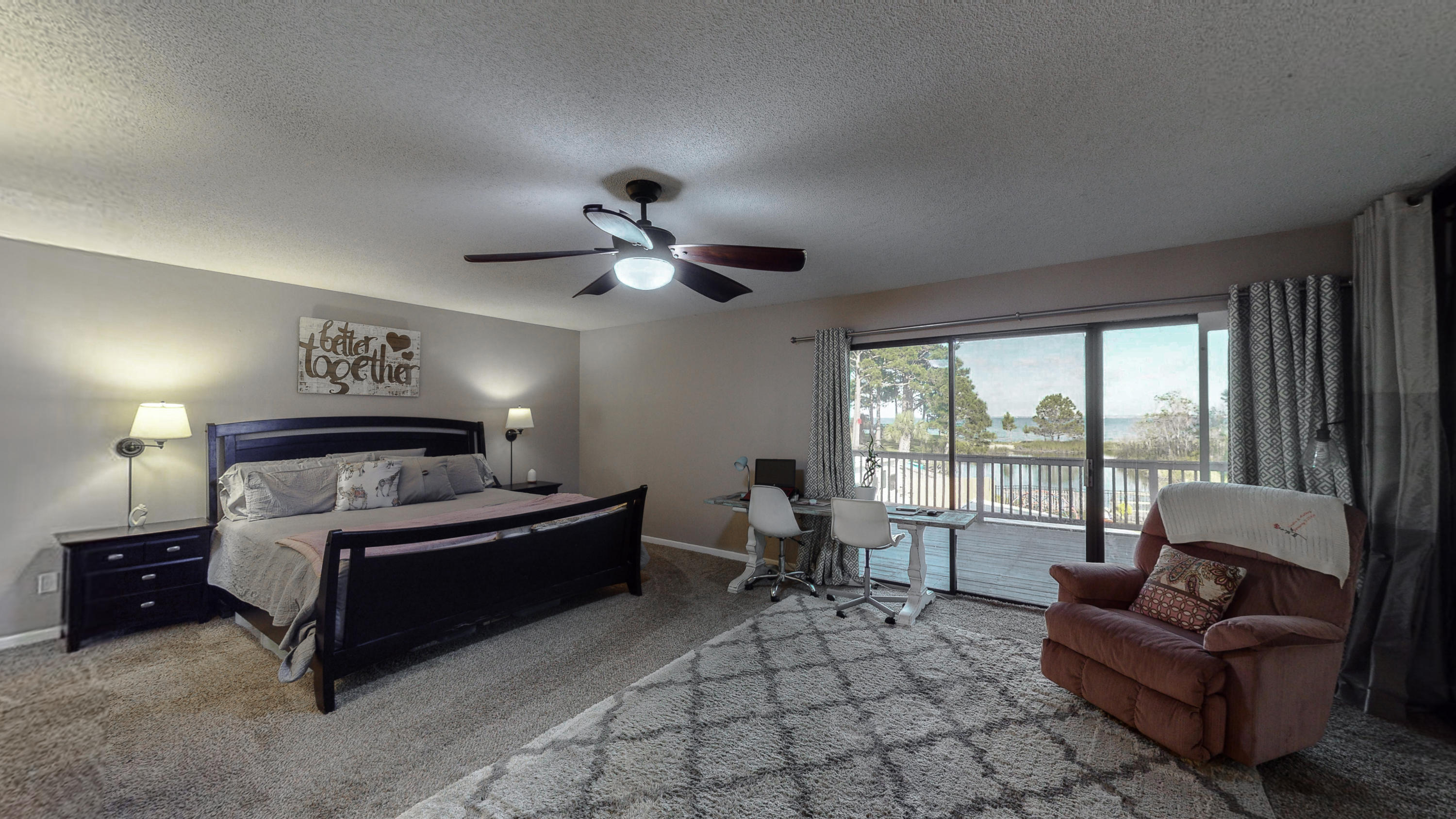 37 Country Club Road Shalimar, FL 32579 - Photo 31 of 64 a spacious bedroom with a bed and glass window