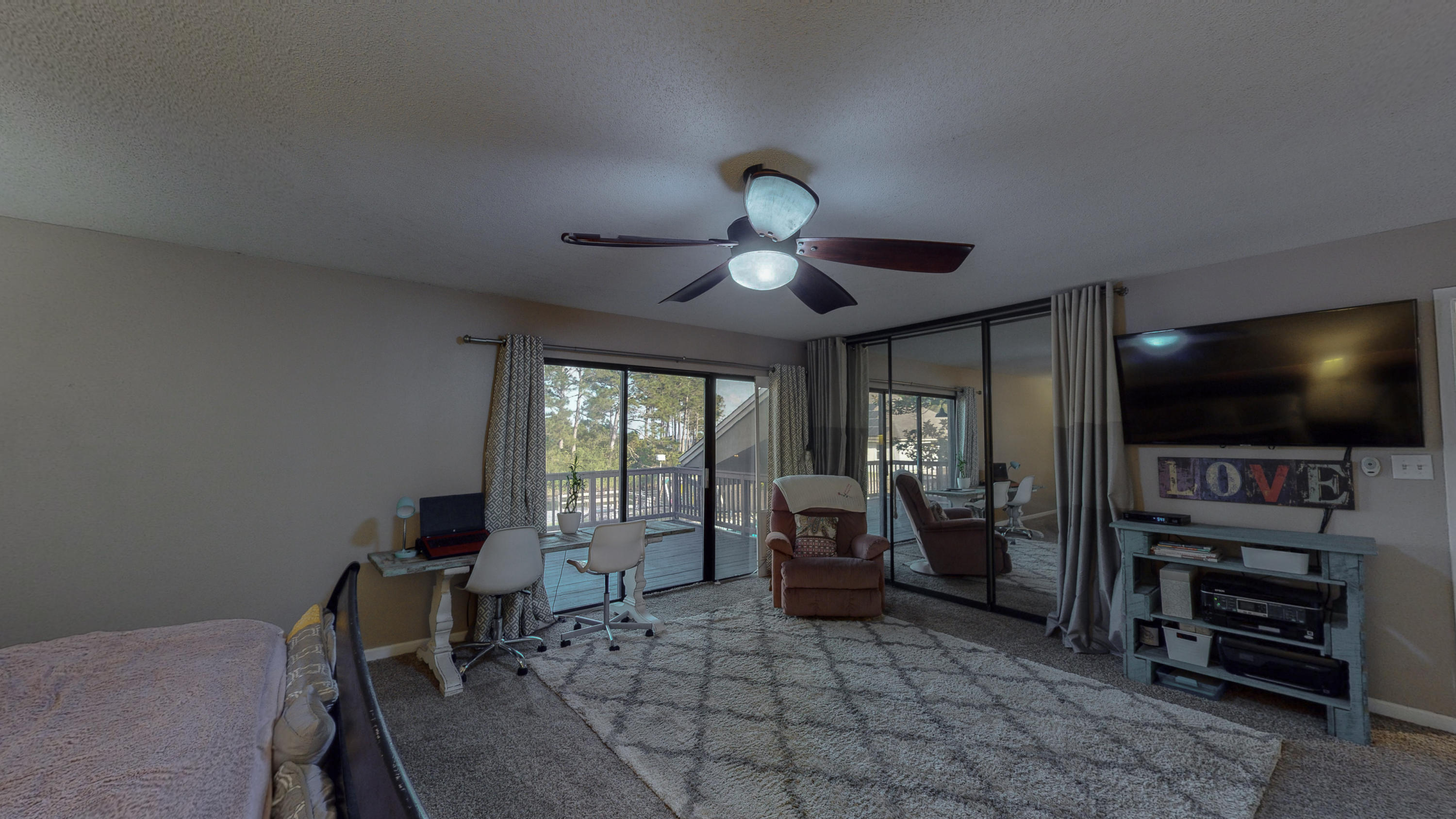 37 Country Club Road Shalimar, FL 32579 - Photo 32 of 64 a view of a livingroom with furniture and a flat screen tv