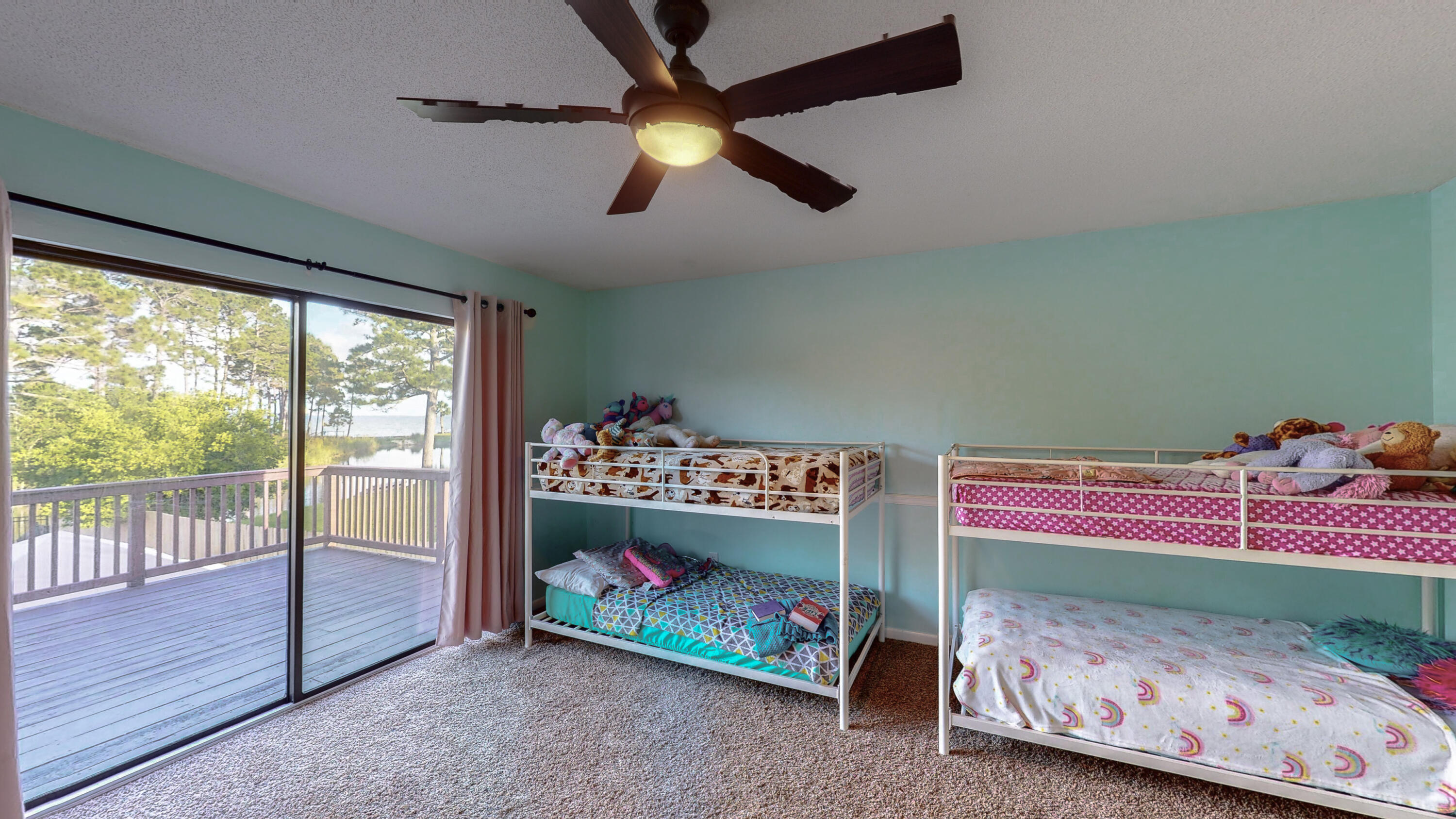 37 Country Club Road Shalimar, FL 32579 - Photo 33 of 64 a bedroom with a bed and a baby crib