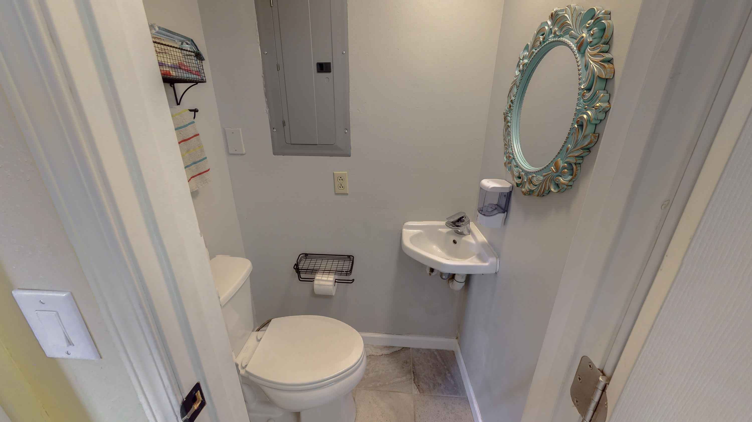 37 Country Club Road Shalimar, FL 32579 - Photo 37 of 64 a bathroom with a toilet a sink and a mirror