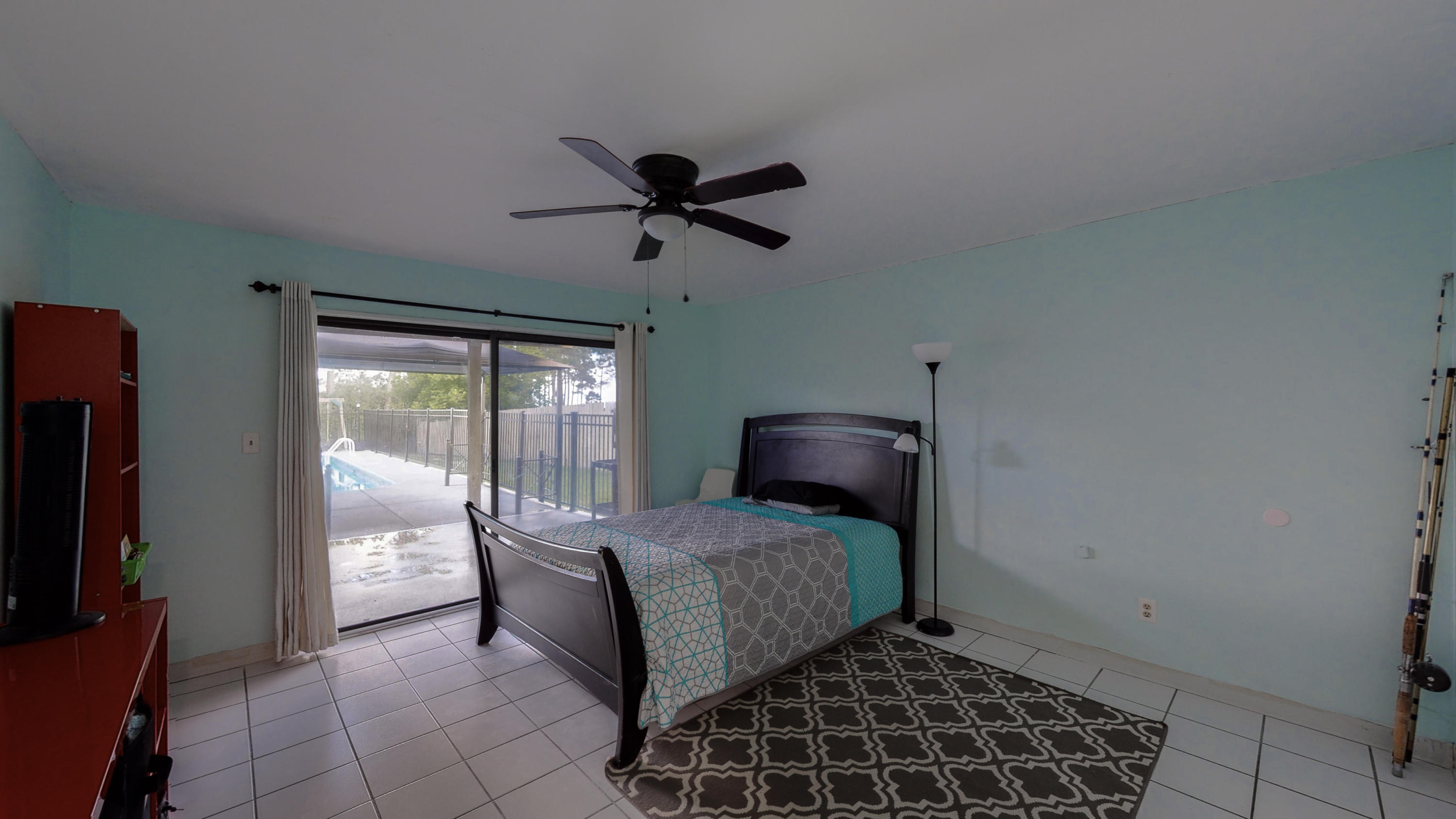 37 Country Club Road Shalimar, FL 32579 - Photo 39 of 64 a bedroom with a bed and a chandelier