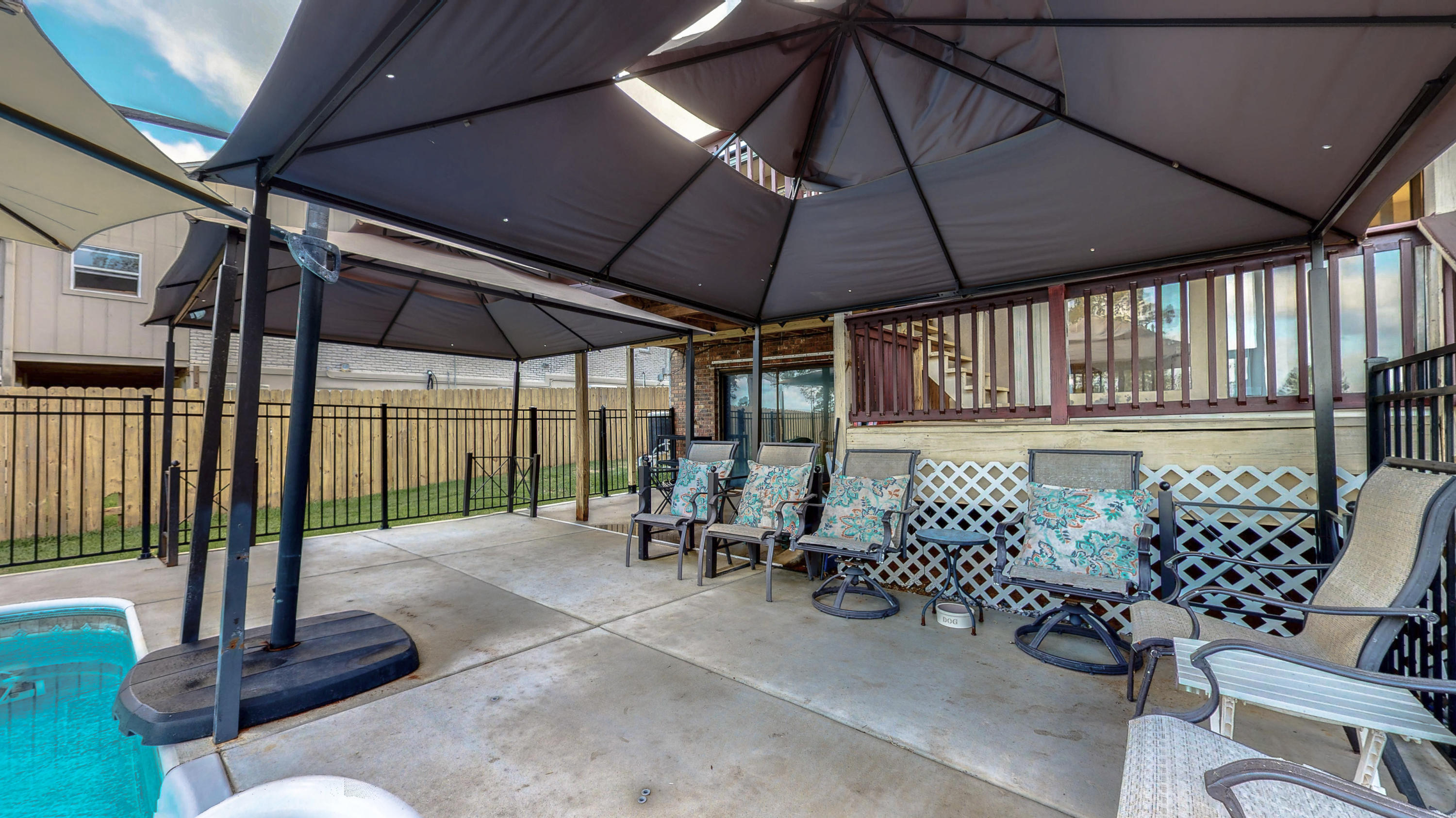 37 Country Club Road Shalimar, FL 32579 - Photo 52 of 64 a view of a patio with table and chairs potted plants