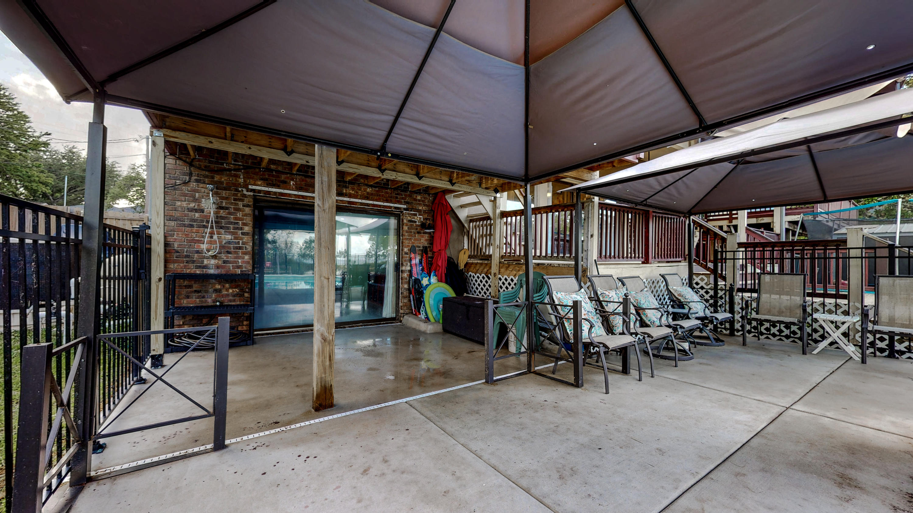 37 Country Club Road Shalimar, FL 32579 - Photo 53 of 64 a view of a tables and chairs under an umbrella