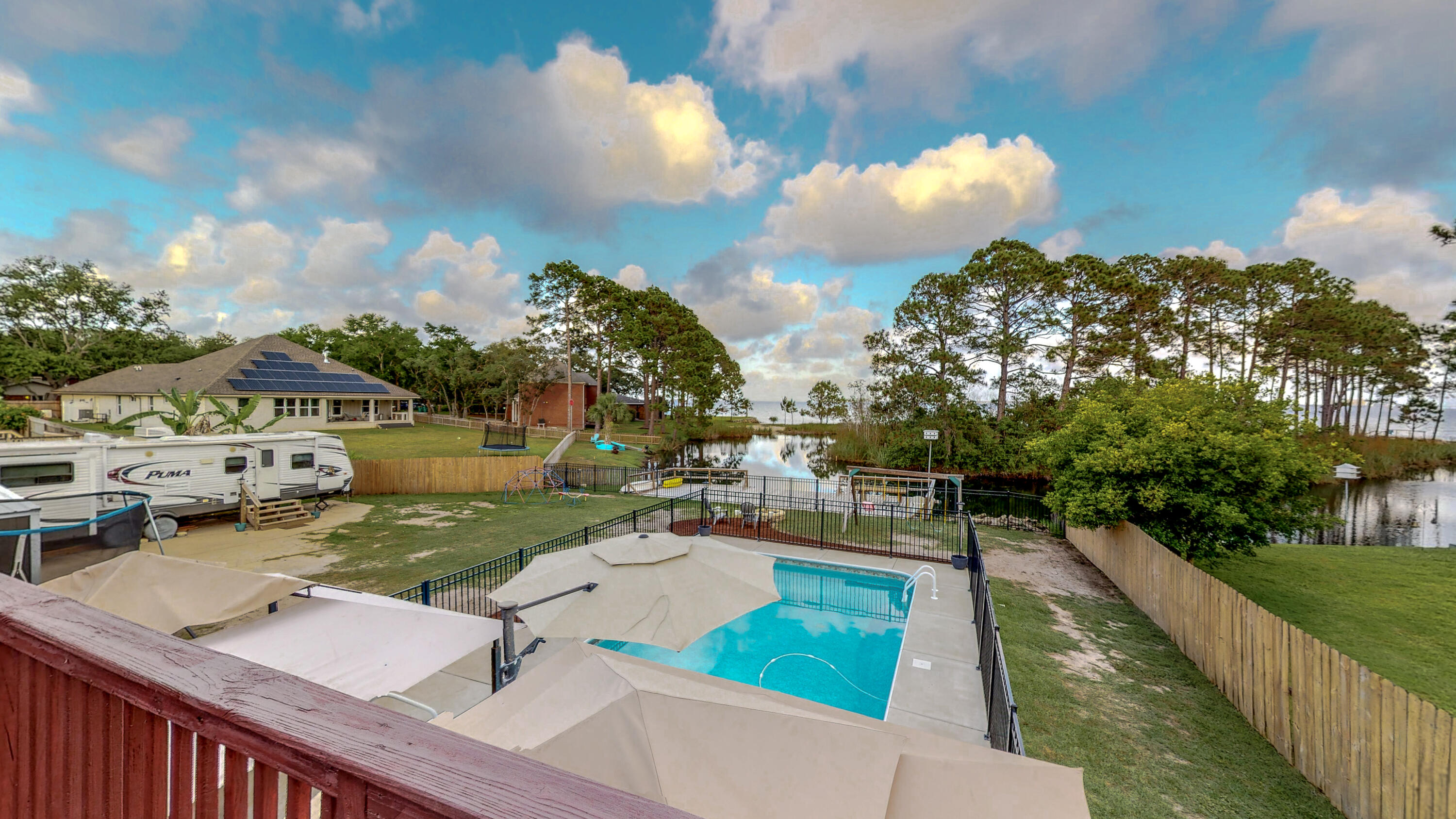 37 Country Club Road Shalimar, FL 32579 - Photo 59 of 64 a view of a patio with swimming pool