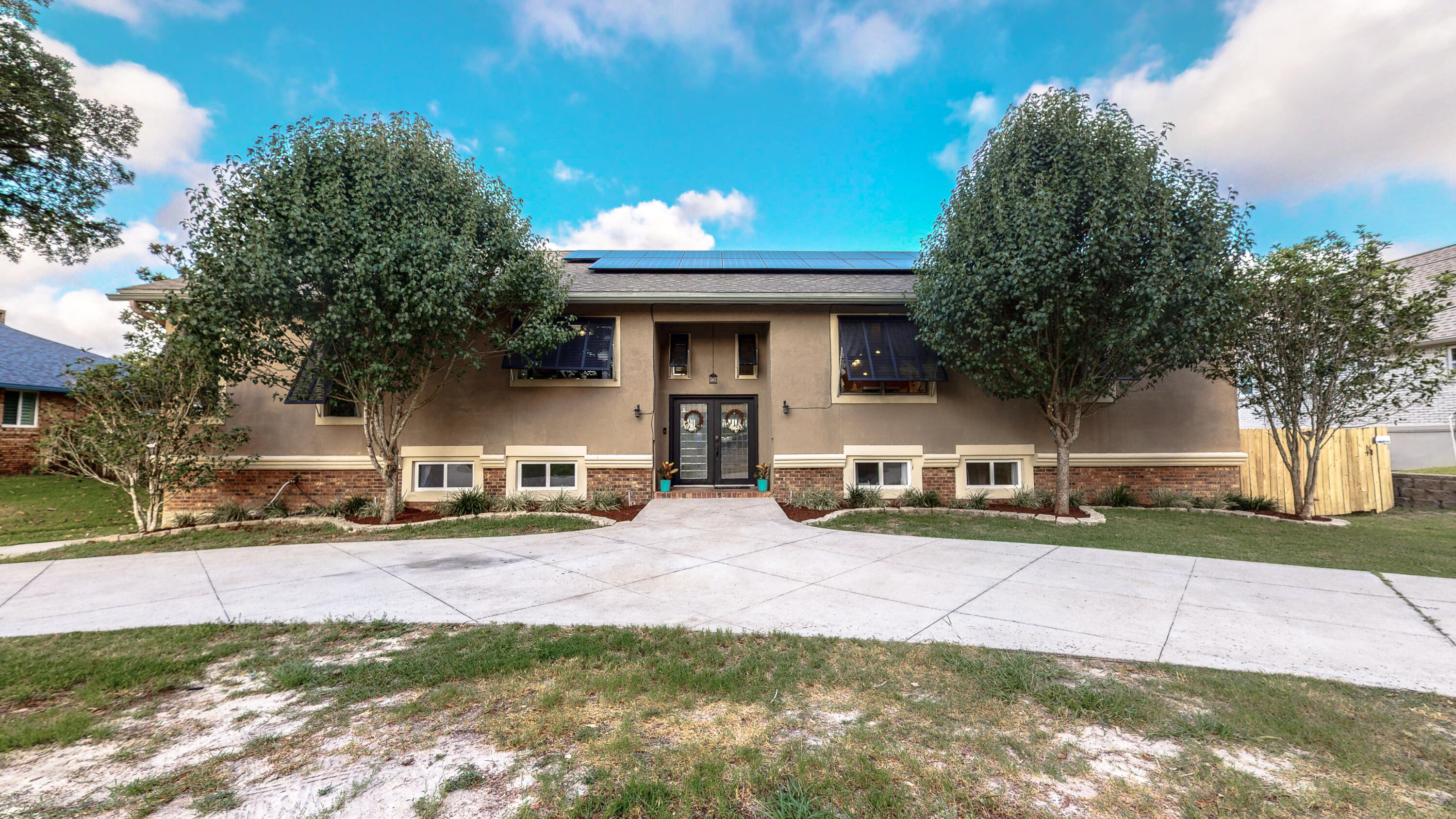 37 Country Club Road Shalimar, FL 32579 - Photo 61 of 64 a view of a house with a yard and large tree