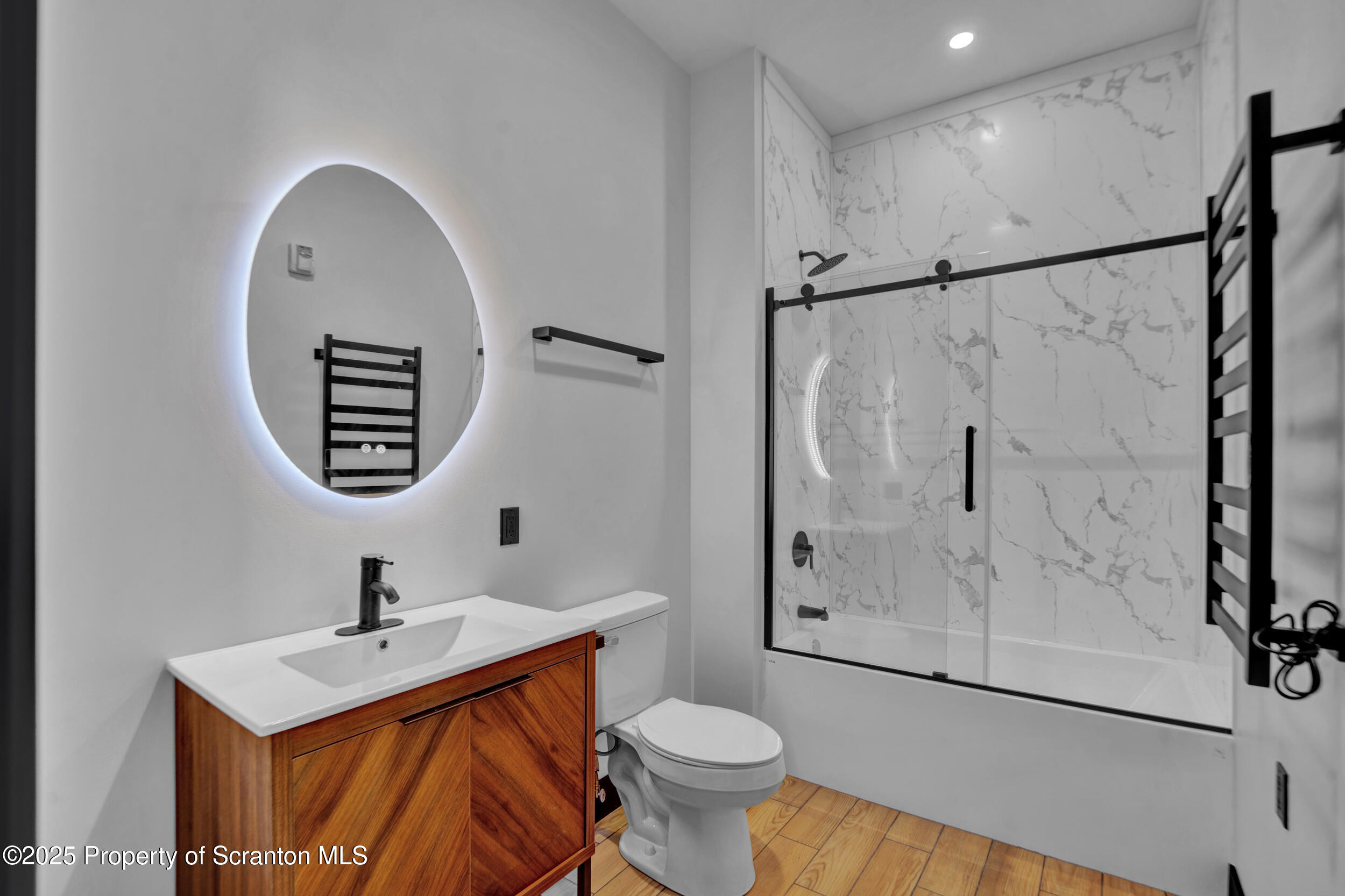 115 Penn Avenue, Unit 202 Scranton, PA 18503 - Photo 19 of 60 a bathroom with a sink mirror toilet and shower