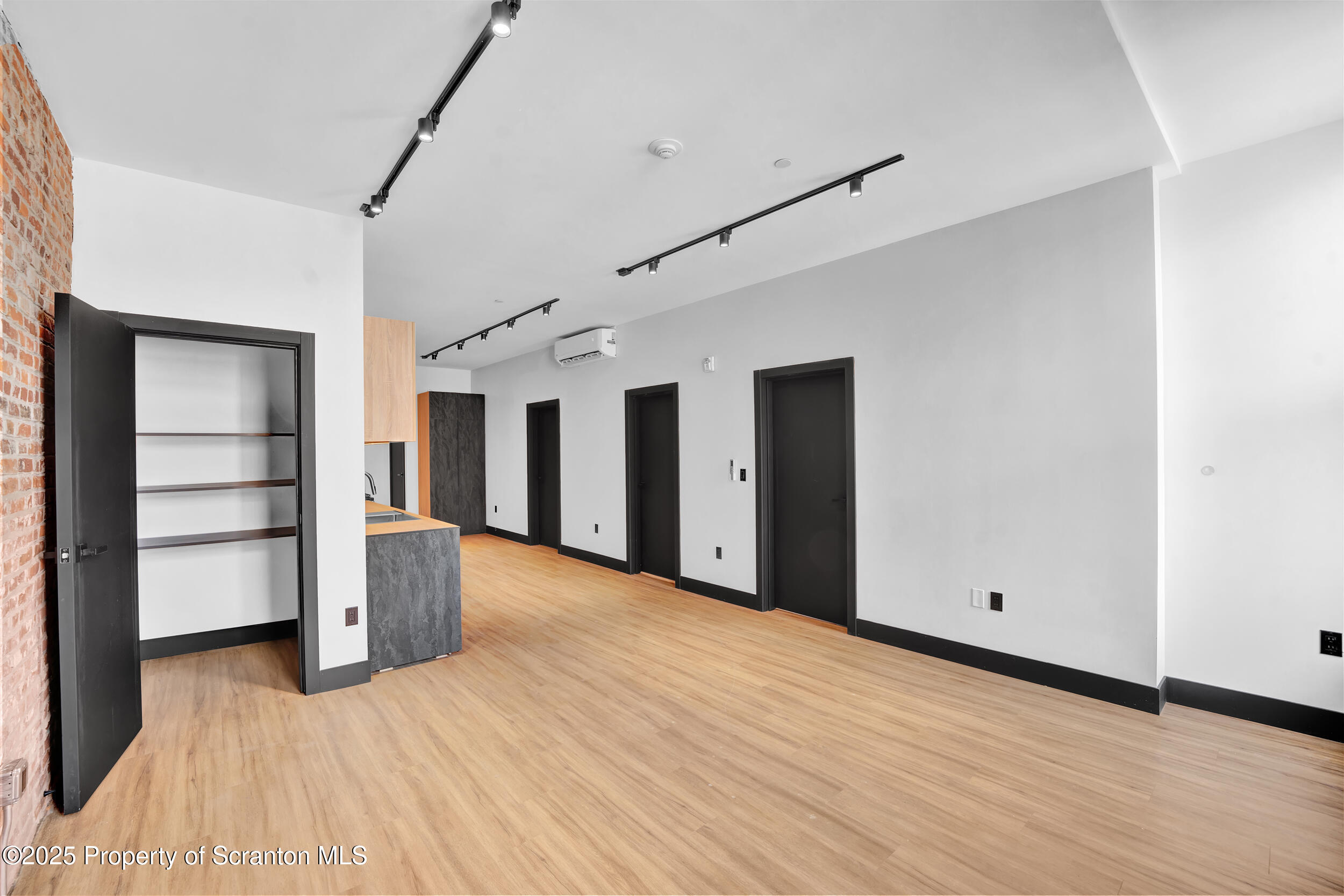 115 Penn Avenue, Unit 202 Scranton, PA 18503 - Photo 36 of 60 a view of empty room with wooden floor