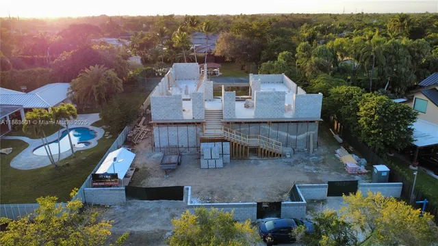 a view of a house with a yard and sitting area
