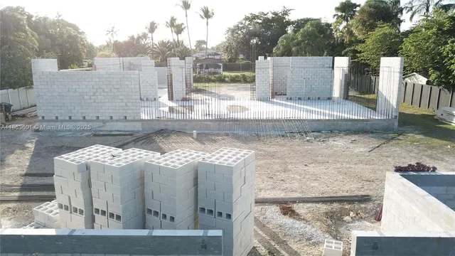 a view of a patio with table and chairs potted plants with wooden floor
