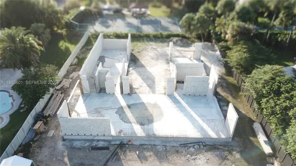 a view of a yard with iron fence