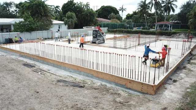 a view of a backyard with sitting area