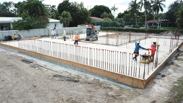 a view of a backyard with sitting area