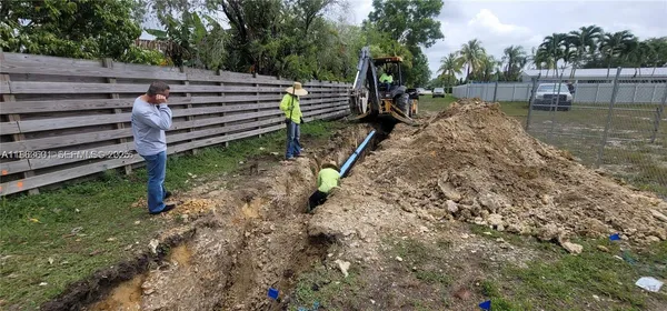 a view of a backyard with swimming pool