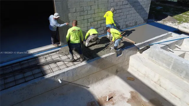 an aerial view of a house with a yard and balcony