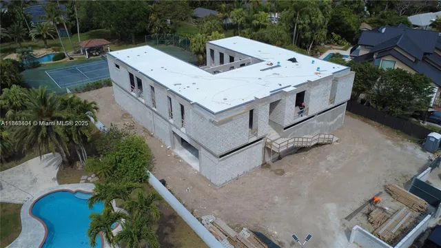 an aerial view of residential house with outdoor space and parking