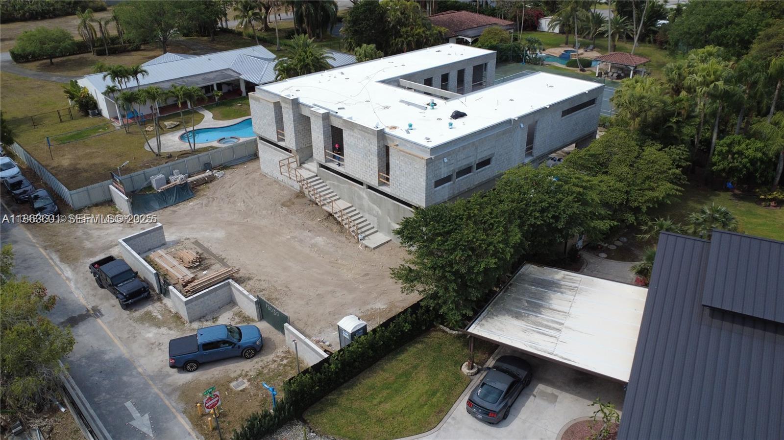 13050 Southwest 103rd Avenue Miami, FL 33176 - Photo 10 of 37 an aerial view of residential house with outdoor space and parking