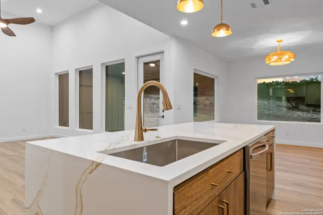 a kitchen with a sink and a microwave