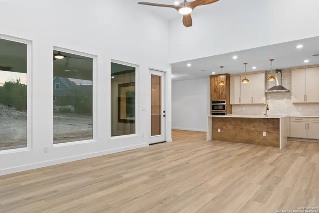 a view of kitchen with wooden floor and window