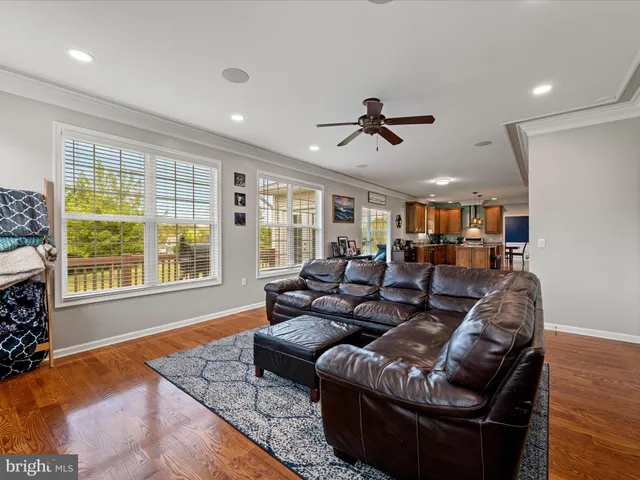 a spacious bathroom with a tub and a large window