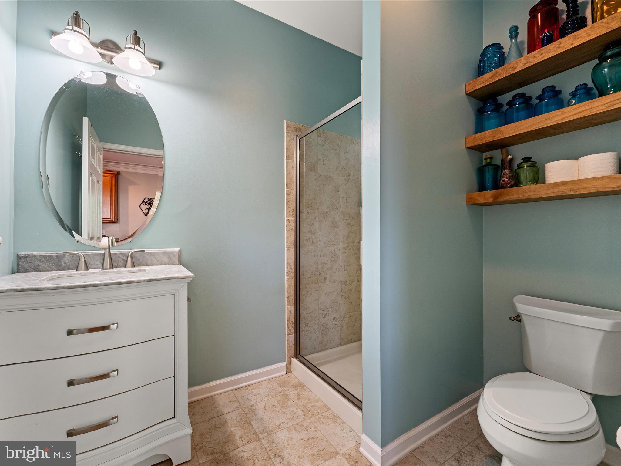 80 Varick Trail Hedgesville, WV 25427 - Photo 27 of 80 a bathroom with a toilet a sink and mirror