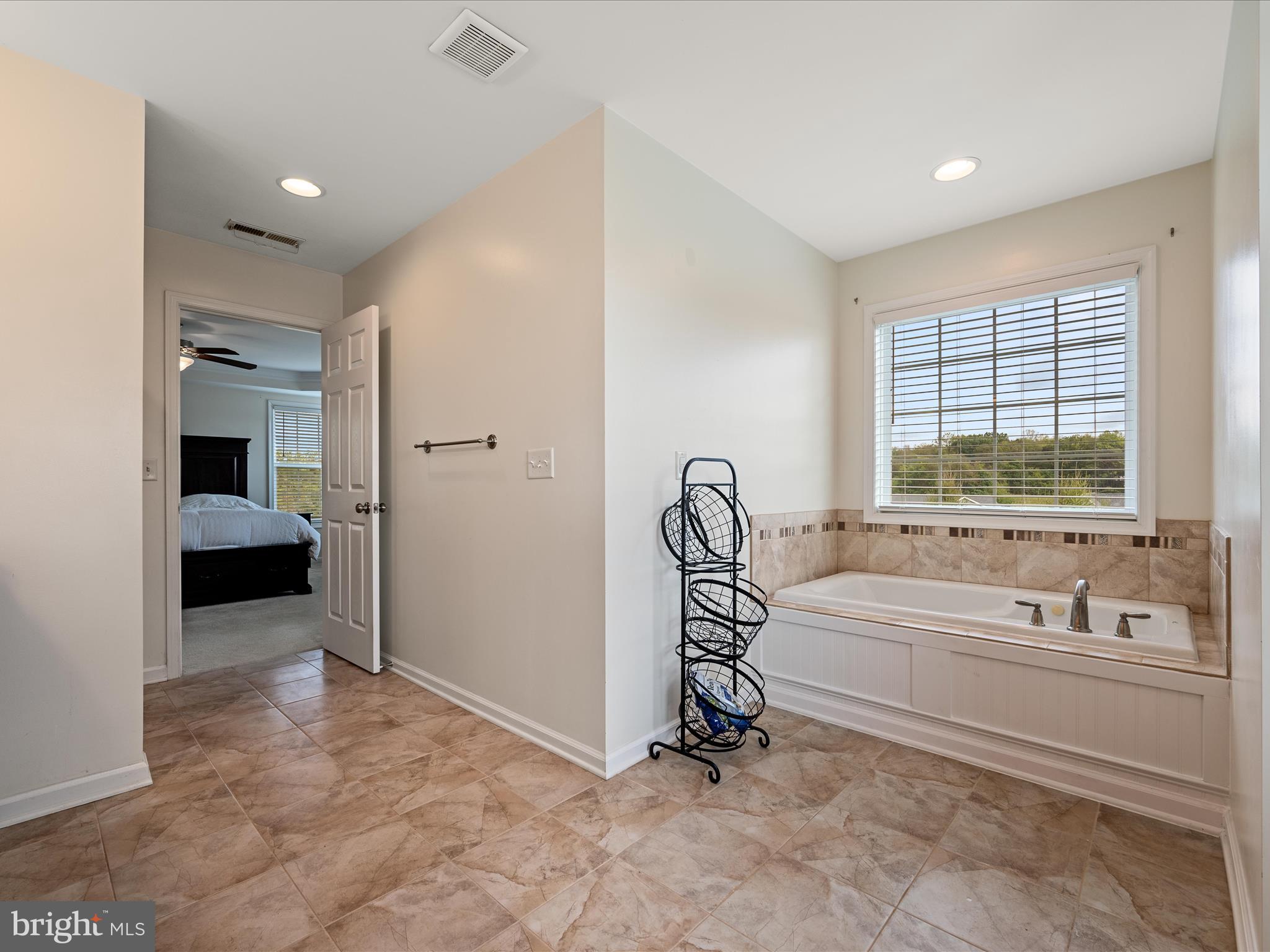 80 Varick Trail Hedgesville, WV 25427 - Photo 36 of 80 a spacious bathroom with a tub and a large window