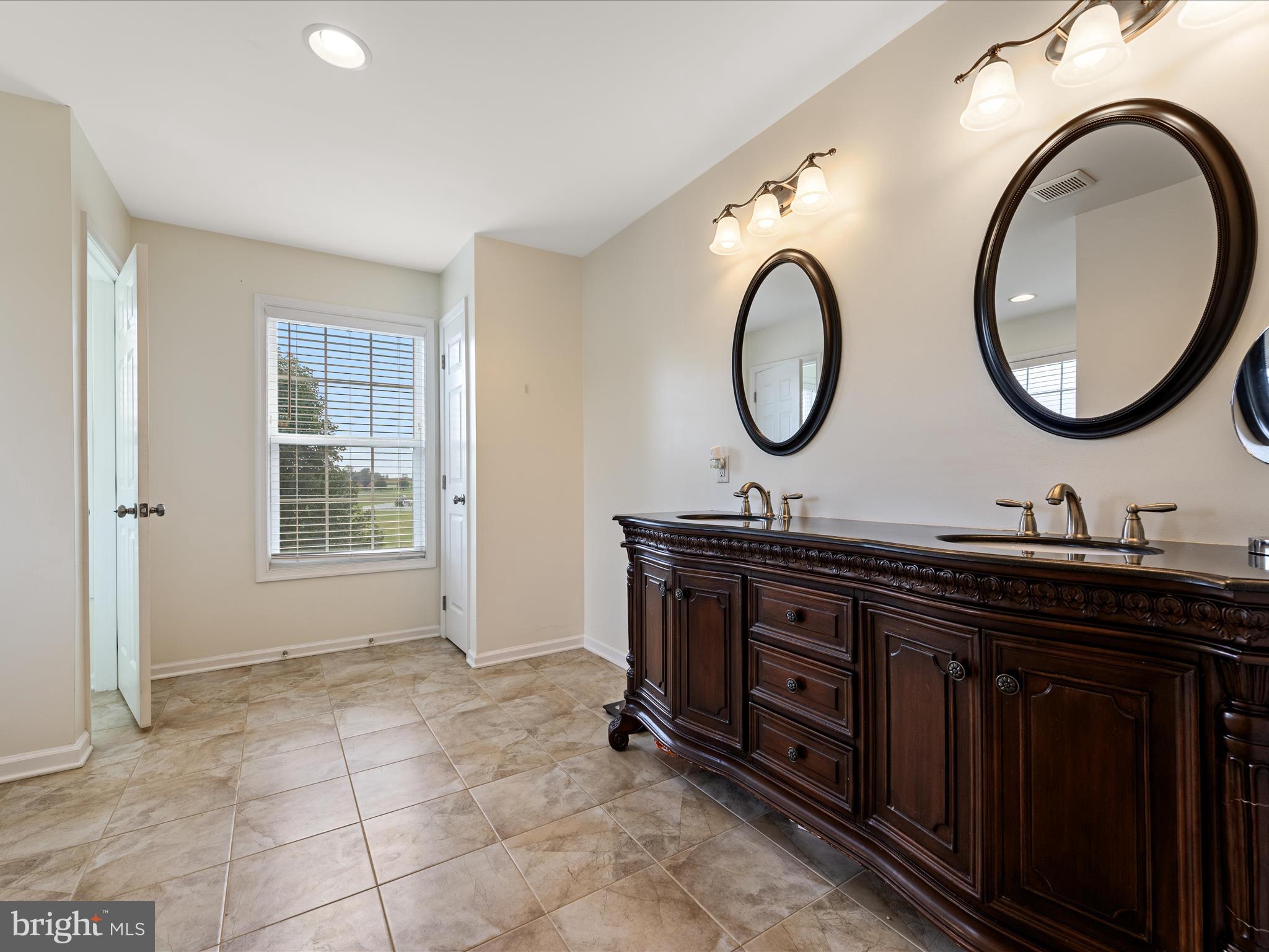 80 Varick Trail Hedgesville, WV 25427 - Photo 39 of 80 a bathroom with a granite countertop double vanity sink and a mirror