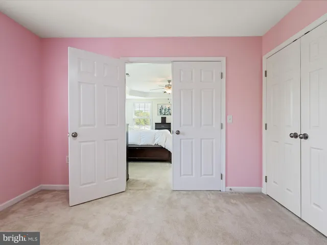 a view of a house with a yard and garage