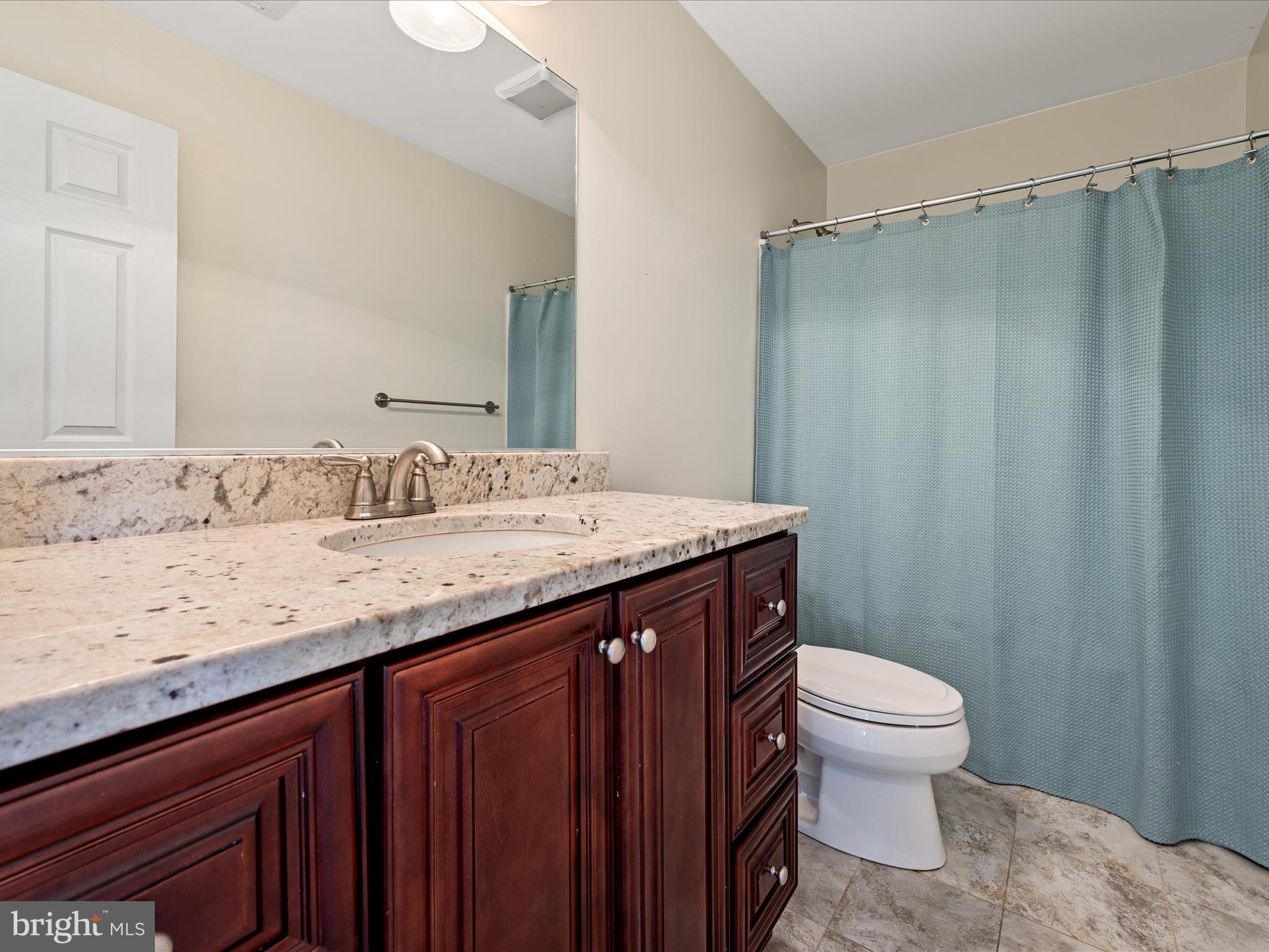 80 Varick Trail Hedgesville, WV 25427 - Photo 46 of 80 a bathroom with a granite countertop sink toilet and shower