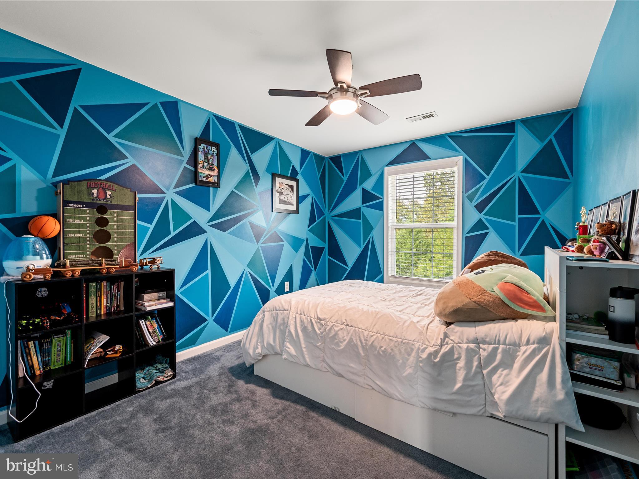 80 Varick Trail Hedgesville, WV 25427 - Photo 47 of 80 a bedroom with a bed and a chandelier