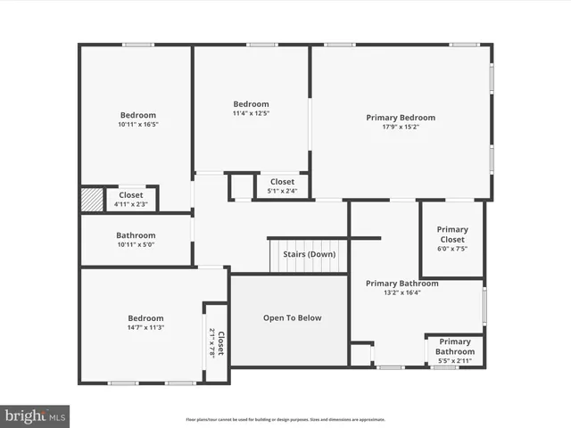 an aerial view of a house with a yard and lake view