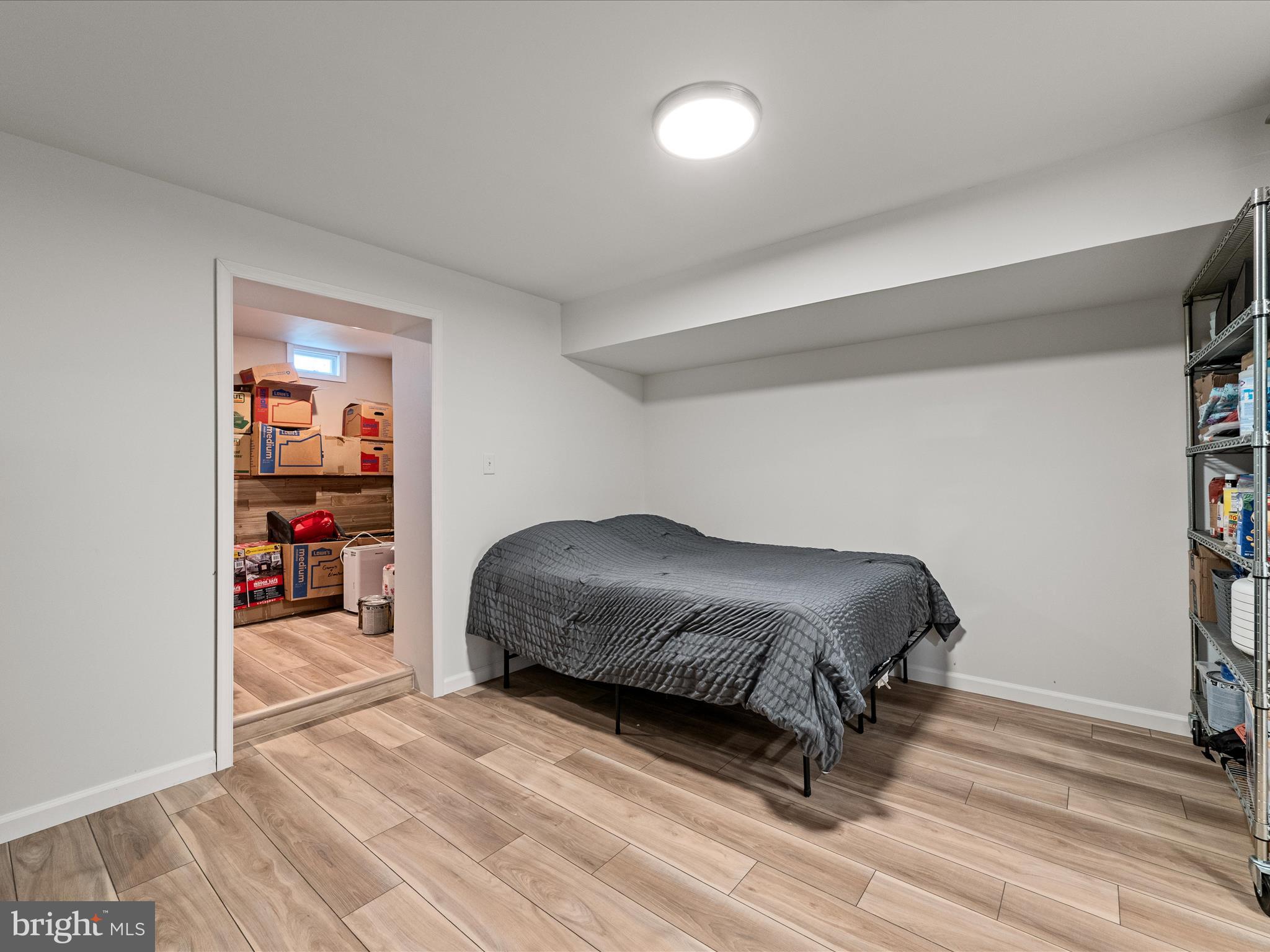 80 Varick Trail Hedgesville, WV 25427 - Photo 57 of 80 a bedroom with a bed and a book shelf