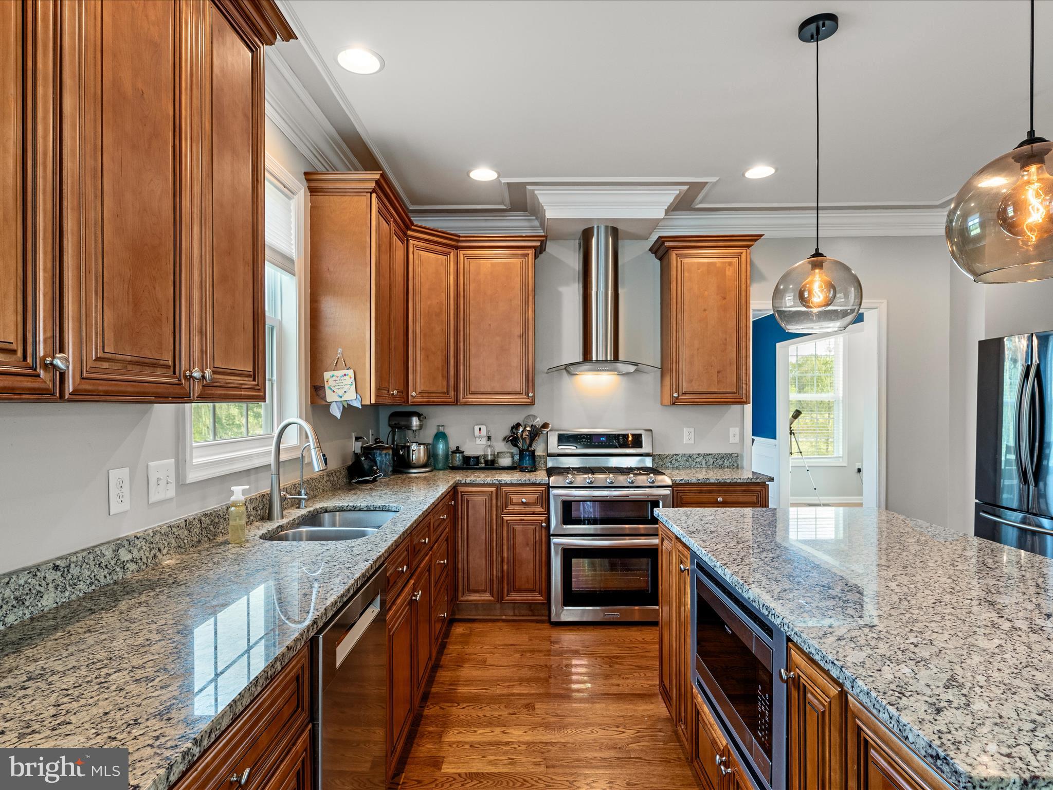 80 Varick Trail Hedgesville, WV 25427 - Photo 9 of 80 a kitchen with stainless steel appliances granite countertop a sink a stove and a wooden cabinets