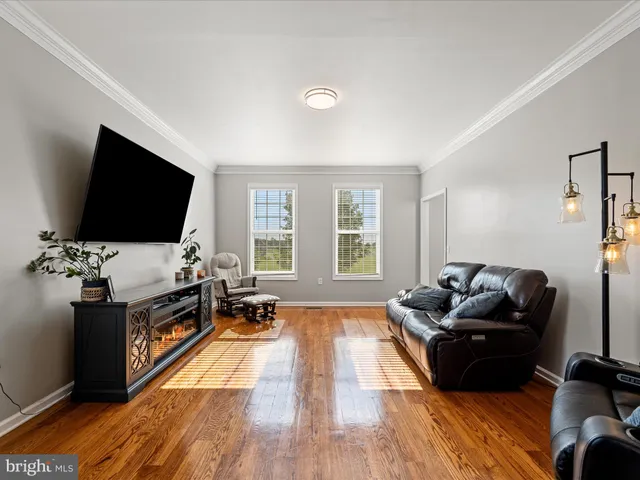 a kitchen with stainless steel appliances granite countertop a sink a stove and a wooden cabinets