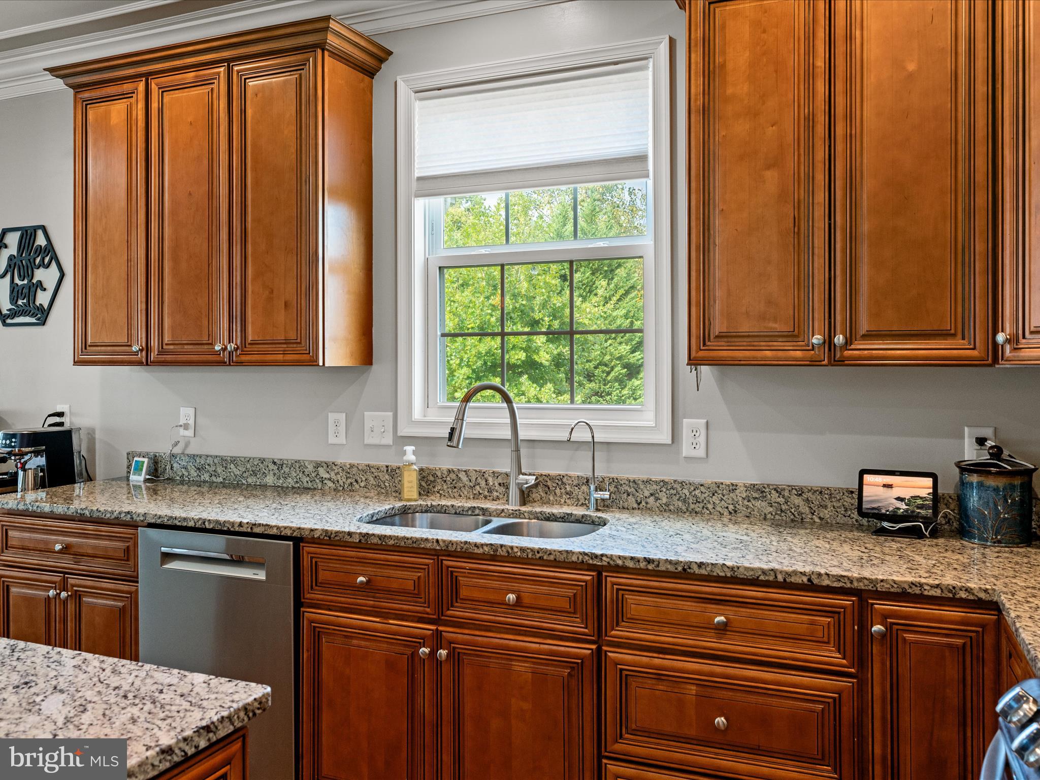 80 Varick Trail Hedgesville, WV 25427 - Photo 10 of 80 a kitchen with stainless steel appliances granite countertop wooden cabinets a sink and a window