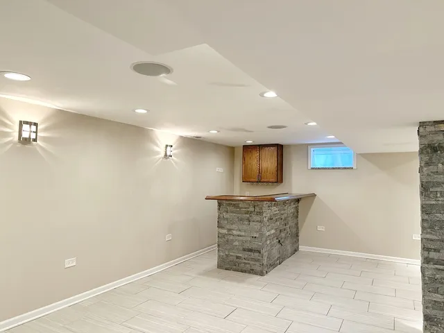 a large room with a couch and a stove top oven