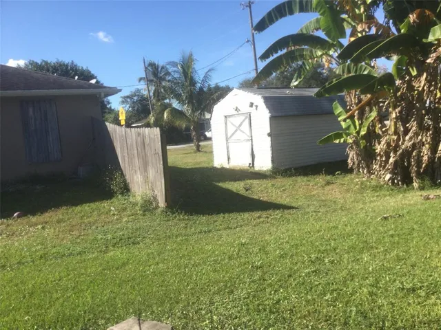 a view of backyard with a garden and plants