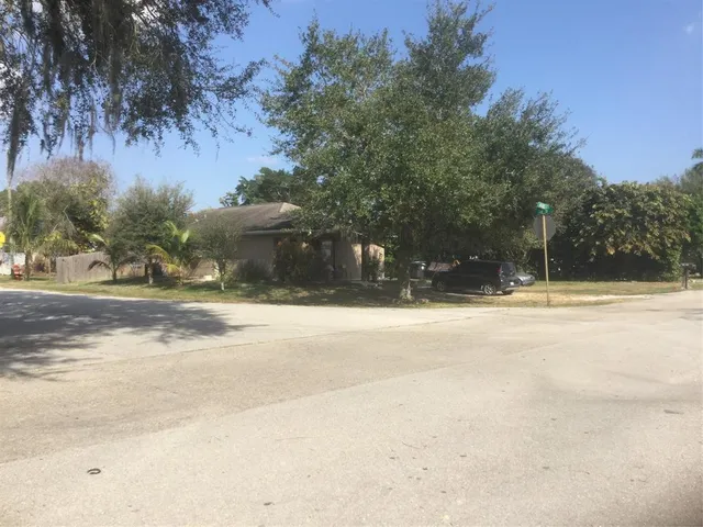a view of swimming pool with a yard