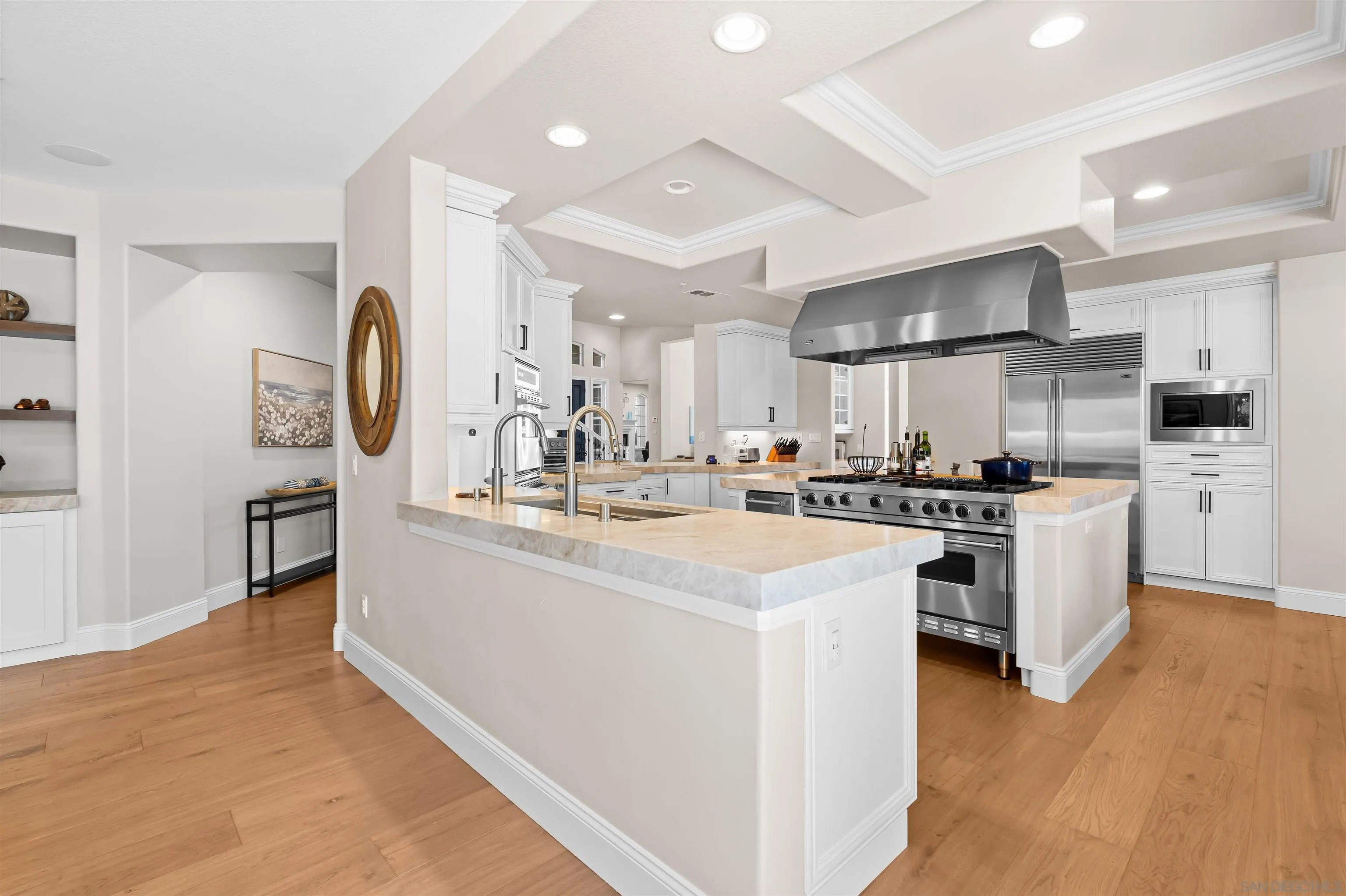301 Cantle Lane Encinitas, CA 92024 - Photo 11 of 75 a kitchen with stainless steel appliances kitchen island a sink and a refrigerator
