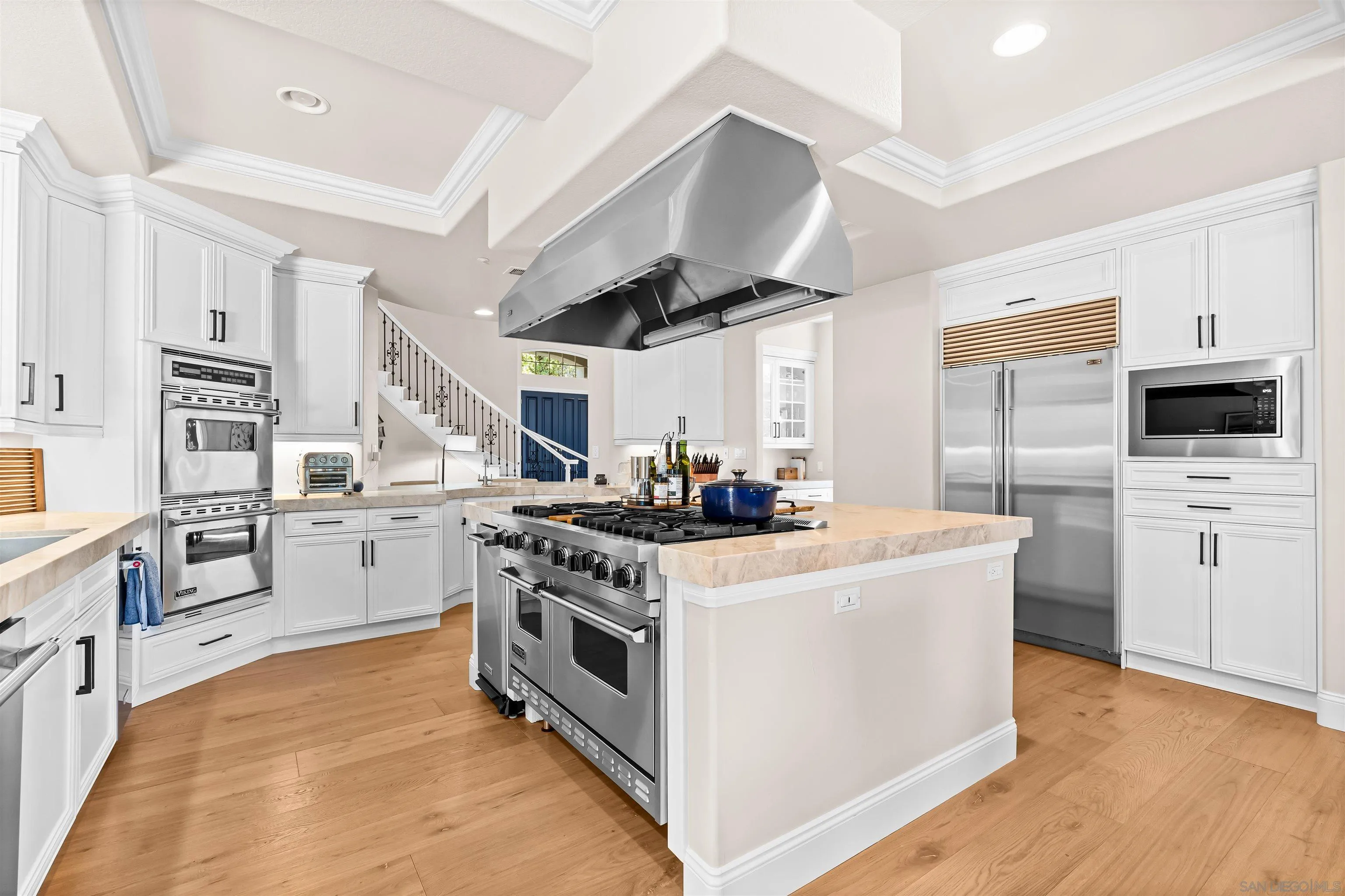 301 Cantle Lane Encinitas, CA 92024 - Photo 12 of 75 a kitchen with stainless steel appliances granite countertop a stove and a refrigerator