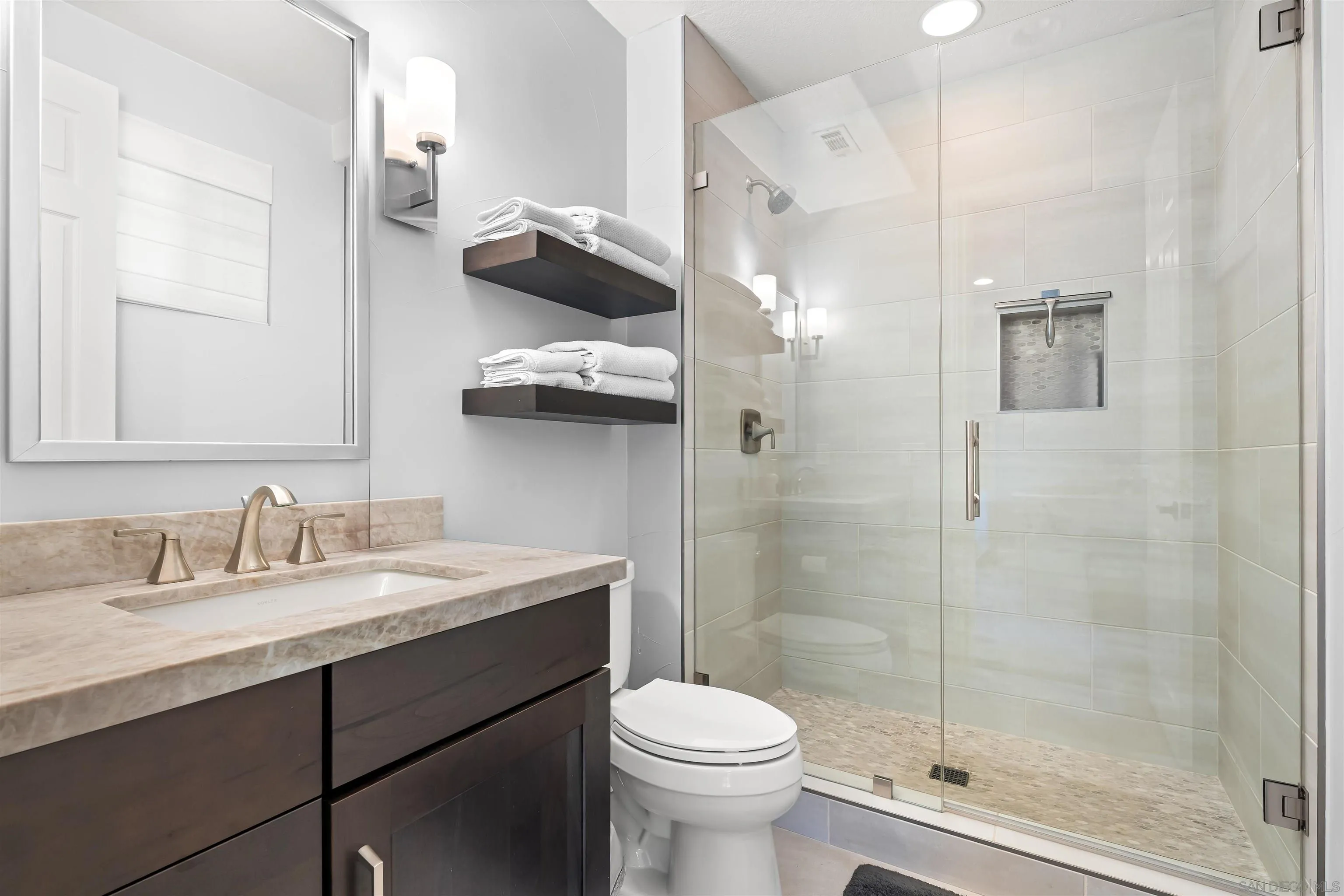 301 Cantle Lane Encinitas, CA 92024 - Photo 21 of 75 a bathroom with a sink a toilet and shower