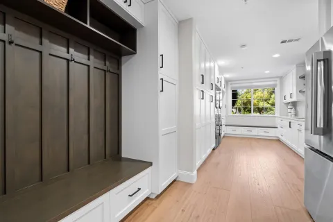 a living room with furniture and large windows