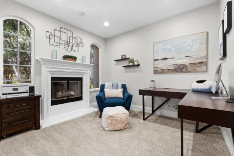 a bedroom with furniture and a chandelier