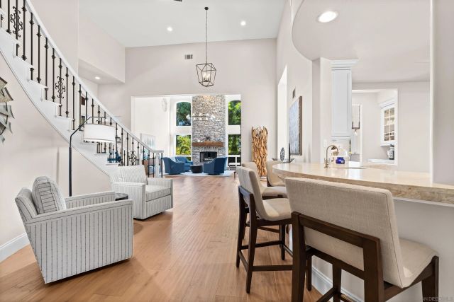 a spacious bathroom with a double vanity sink toilet and a mirror
