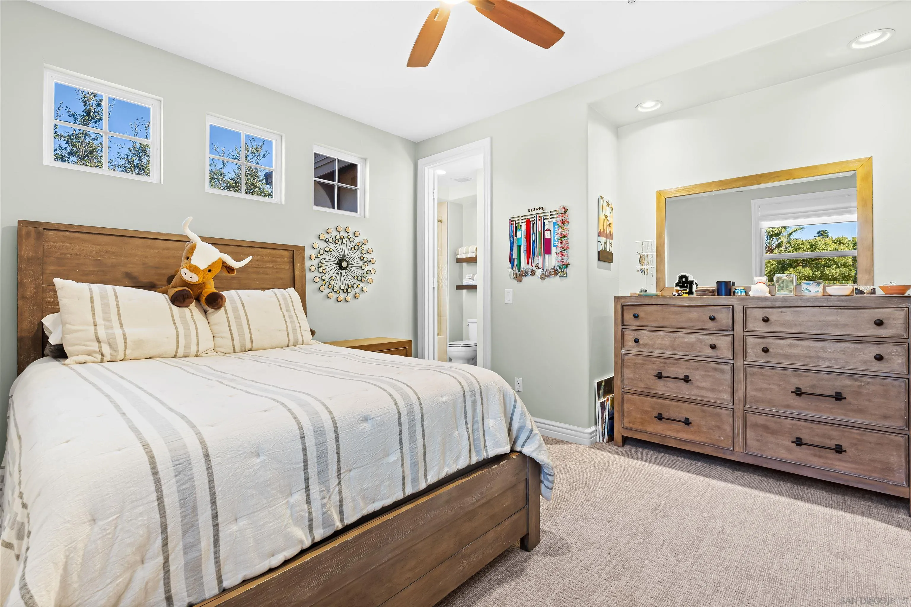 301 Cantle Lane Encinitas, CA 92024 - Photo 32 of 75 a bedroom with a bed and a dresser