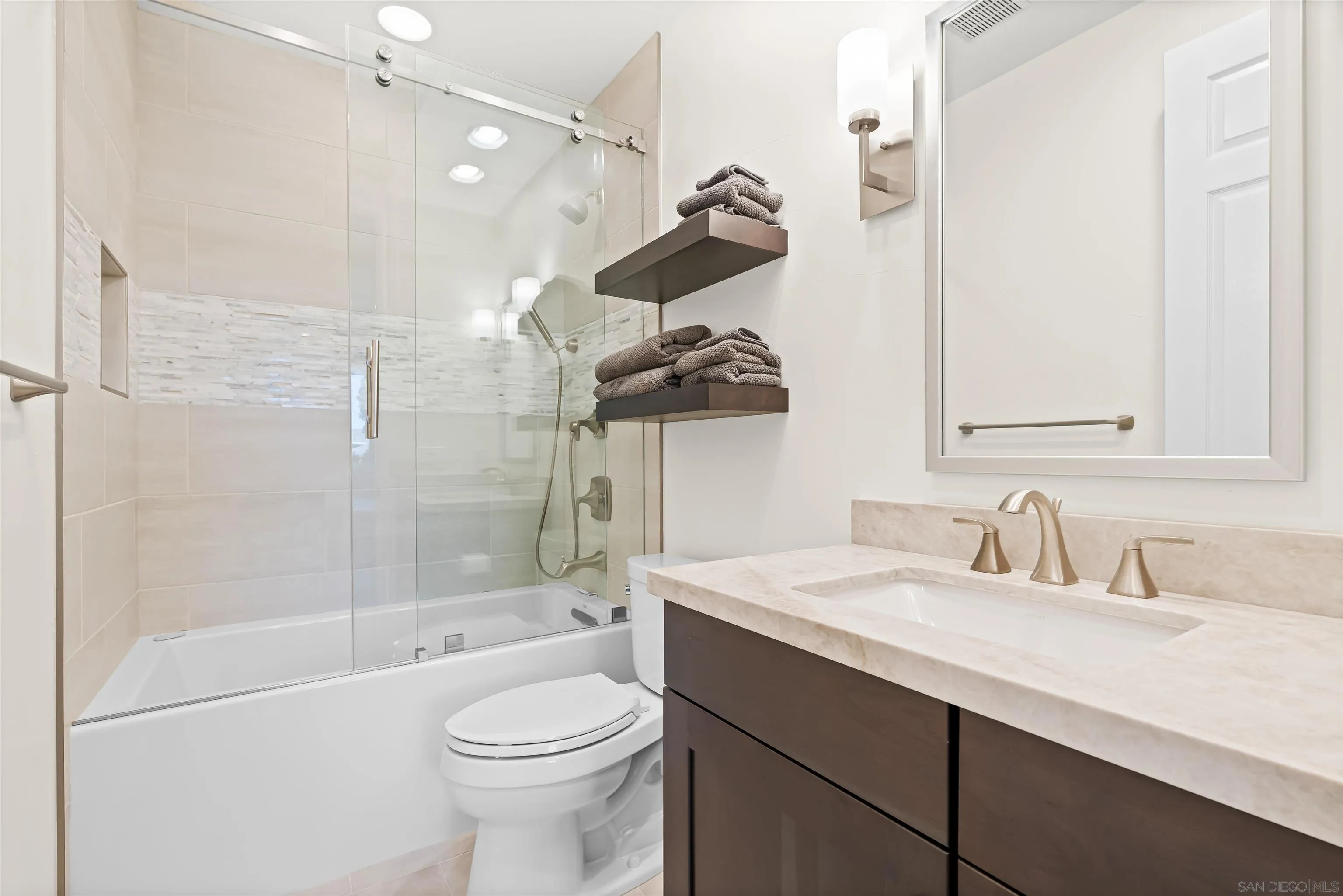 301 Cantle Lane Encinitas, CA 92024 - Photo 33 of 75 a bathroom with a sink a toilet and shower
