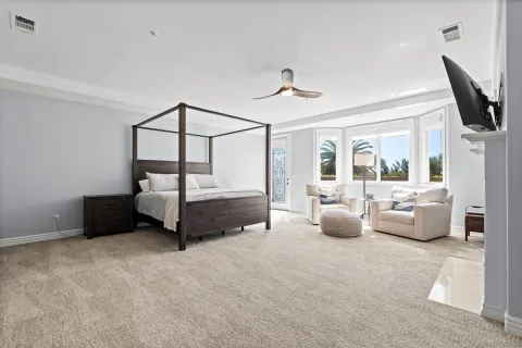 a view of a patio with chairs and a yard