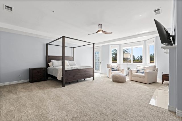 a view of a patio with chairs and a yard