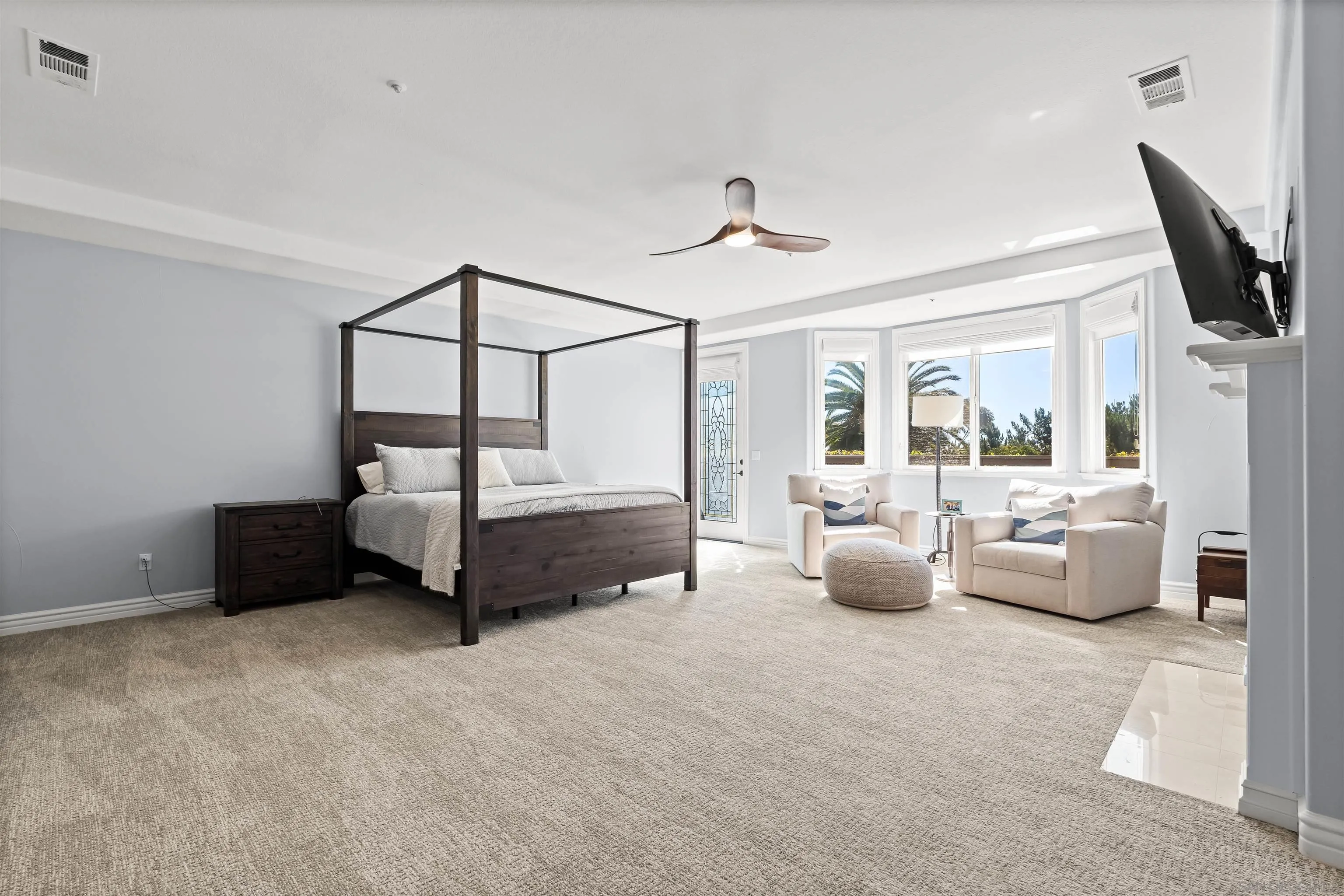 301 Cantle Lane Encinitas, CA 92024 - Photo 34 of 75 a bedroom with furniture and a chandelier